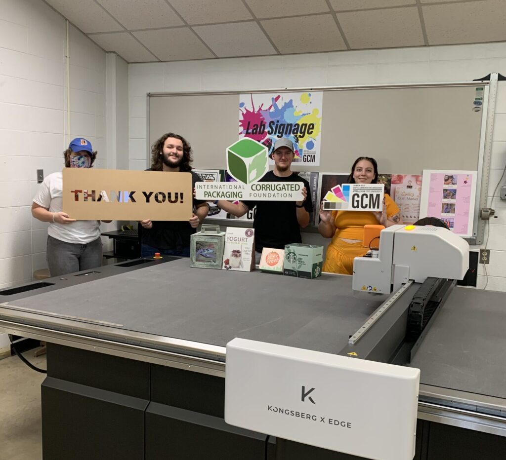 students at Appalachian State University pose with new Kongsberg cutting table
